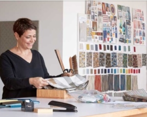 CF Stinson office furniture designer looking through fabric samples for custom upholstery