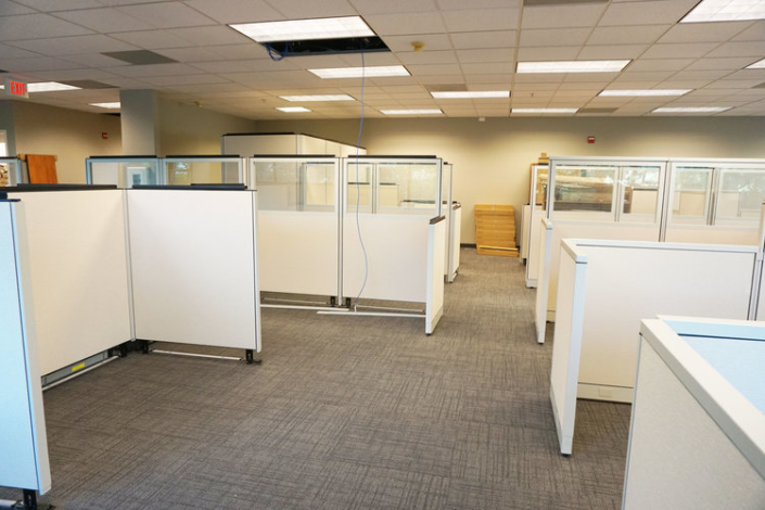 Modern bright white cubicle workstations with glass panel stackers