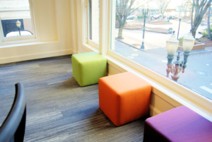 Soft seating cubes in bright colors for commercial office space