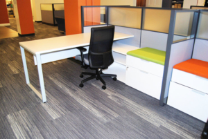 Desk and workstation in white finish with bright green pedestal cushion