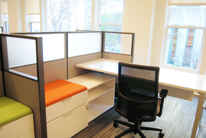 Modern cubicle workstation with glass panel stackers and height adjustable desk