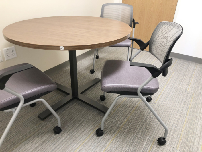 round table with x base and chairs with casters for break room
