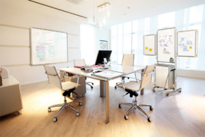 Ghent office furniture square conference table with mobile task chairs in bright modern office space