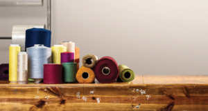 Guilford of maine rolls of textiles on wood surface for custom upholstery