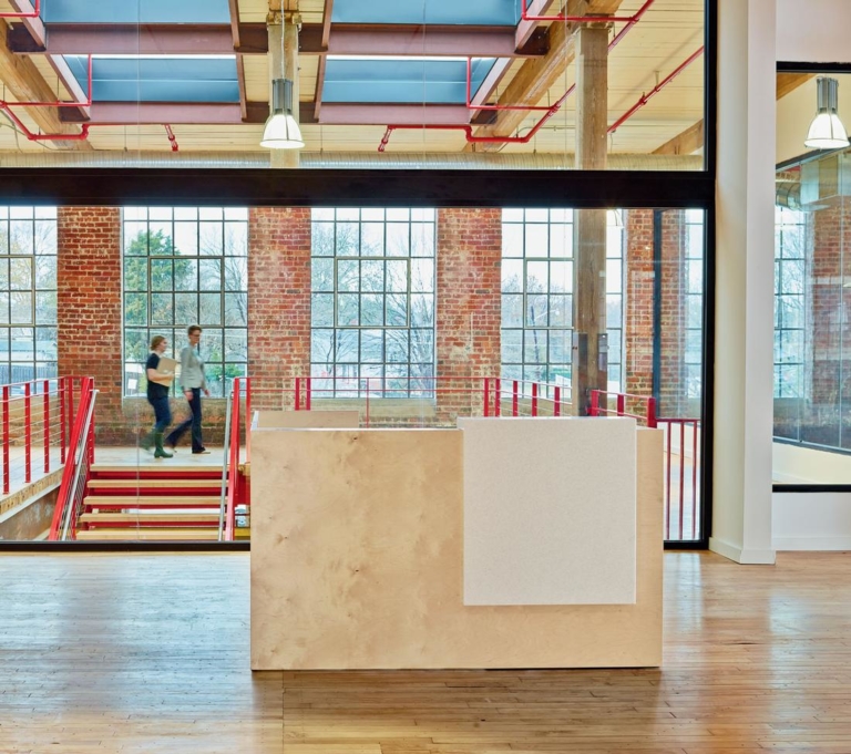 Darran open concept office interior with modern wood reception desk