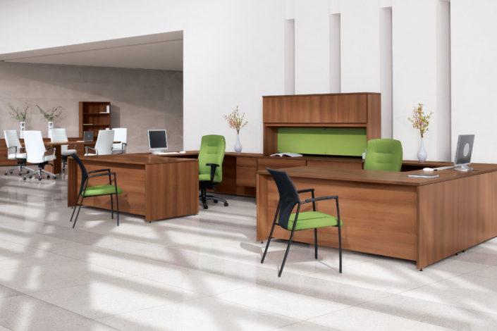 Global furniture large private office area with wood finish desks and guest chairs