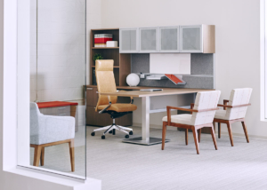 OFS private office with height adjustable L shaped executive desk with natural wood finish