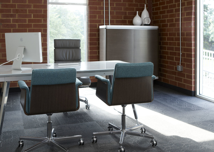 OFS modern private office with upholstered chairs