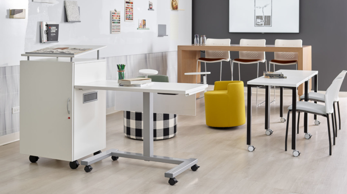 OFS mobile standing height desk and soft seating for modern office central oregon