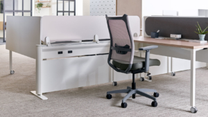 OFS ergonomic desk with storage and privacy panel