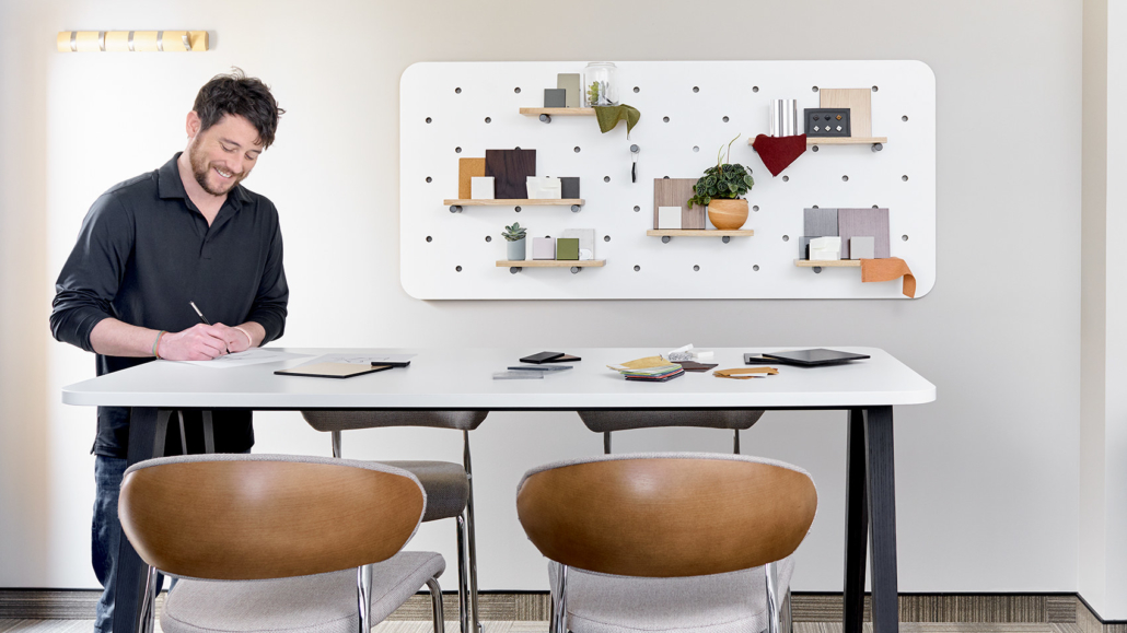 OFS modern conference area with bulletin board and lounge chairs