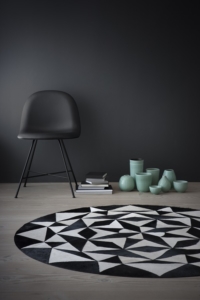 Cloak office furniture geometric black and white rug with black chair for custom work spaces
