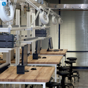 Formaspace office furniture lab space with overhead adjustable lighting and natural wood desk surfaces