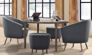 Integra collaborative desk with soft guest seating for commercial office