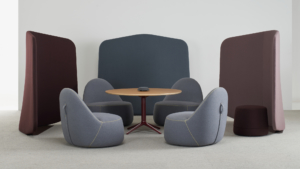 Bernhardt office furniture gray soft seating area around round wood table for commercial office