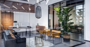 A close-up interior meeting room in a modern office space. The office is decorated with plants and modern furniture.