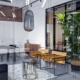 A close-up interior meeting room in a modern office space. The office is decorated with plants and modern furniture.